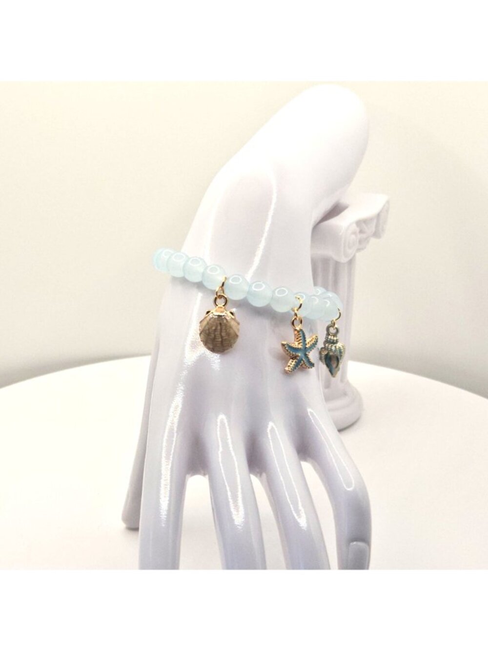 Ocean-Inspired Stretch Bead Bracelet With Starfish Shell And Conch Charms